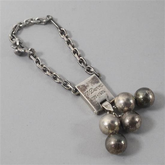 A white metal key ring fob, inscribed S.J. Dupont, Paris, 1789-1989.